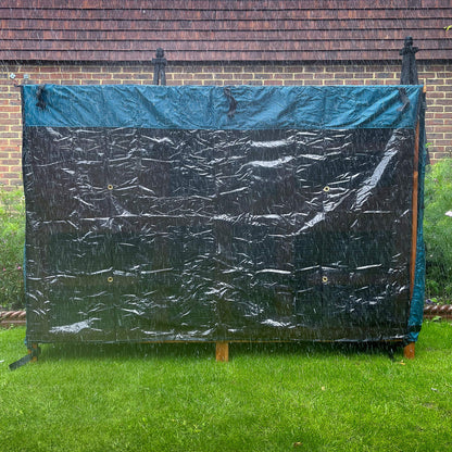 5ft double rabbit hutch rain cover day dry cover placed in a garden on a rainy day
