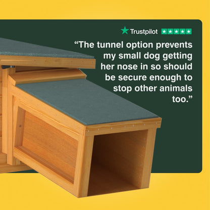 Wooden pet tunnel with green cushion on a yellow background, featuring Trustpilot rating.